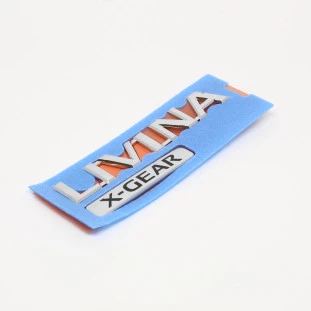 Emblema Tampa Traseira Nissan Livina 2010 a 2014 - Traseiro / Externo - Original